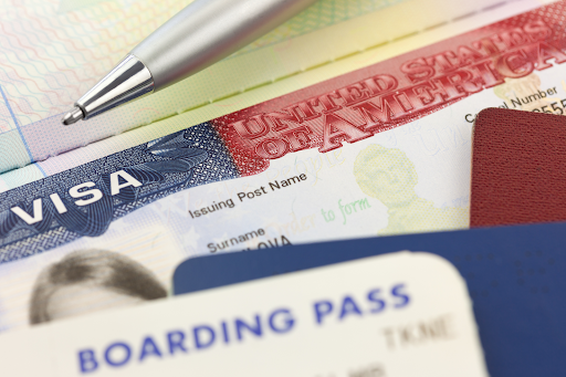 Visa documents and a boarding pass