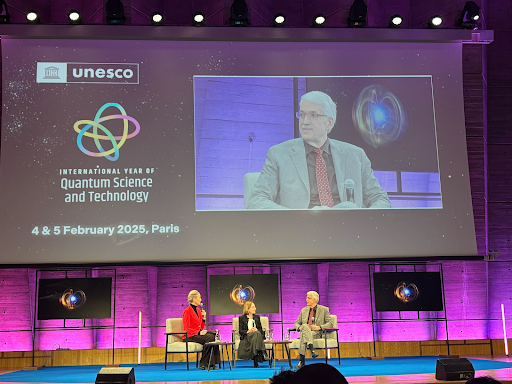 2025 APS President John Doyle on stage at the IYQ Opening Ceremony in Paris.
