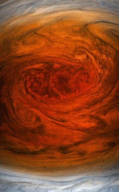 A rounded swirl of red center and orange and yellow gradient.