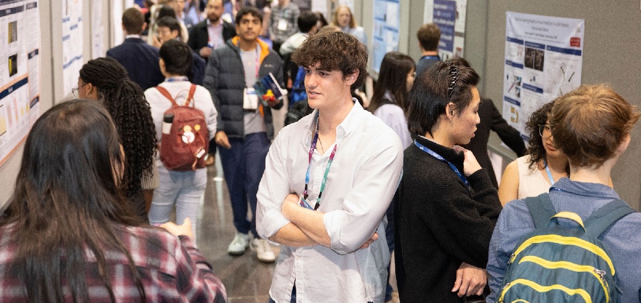 Scientists presenting posters at an APS meeting
