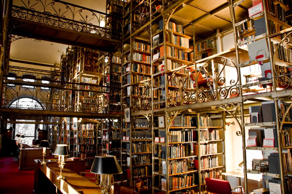 Ornate metal library stacks and catwalks
