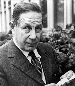 George de Mestral, holding a strip of Velcro®