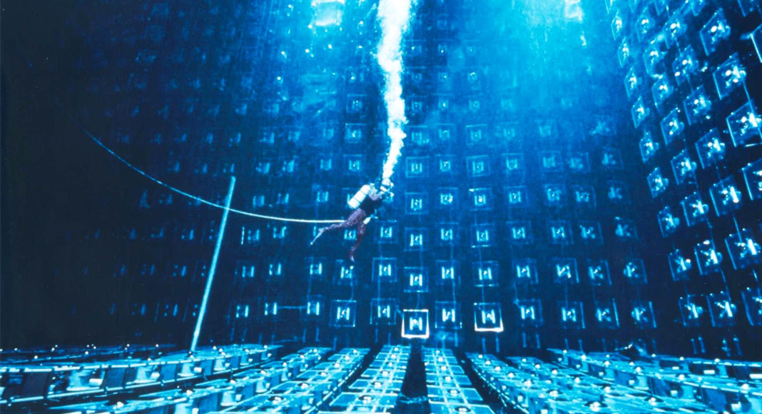 A diver attached to a cable moves through the IMB’s tank.