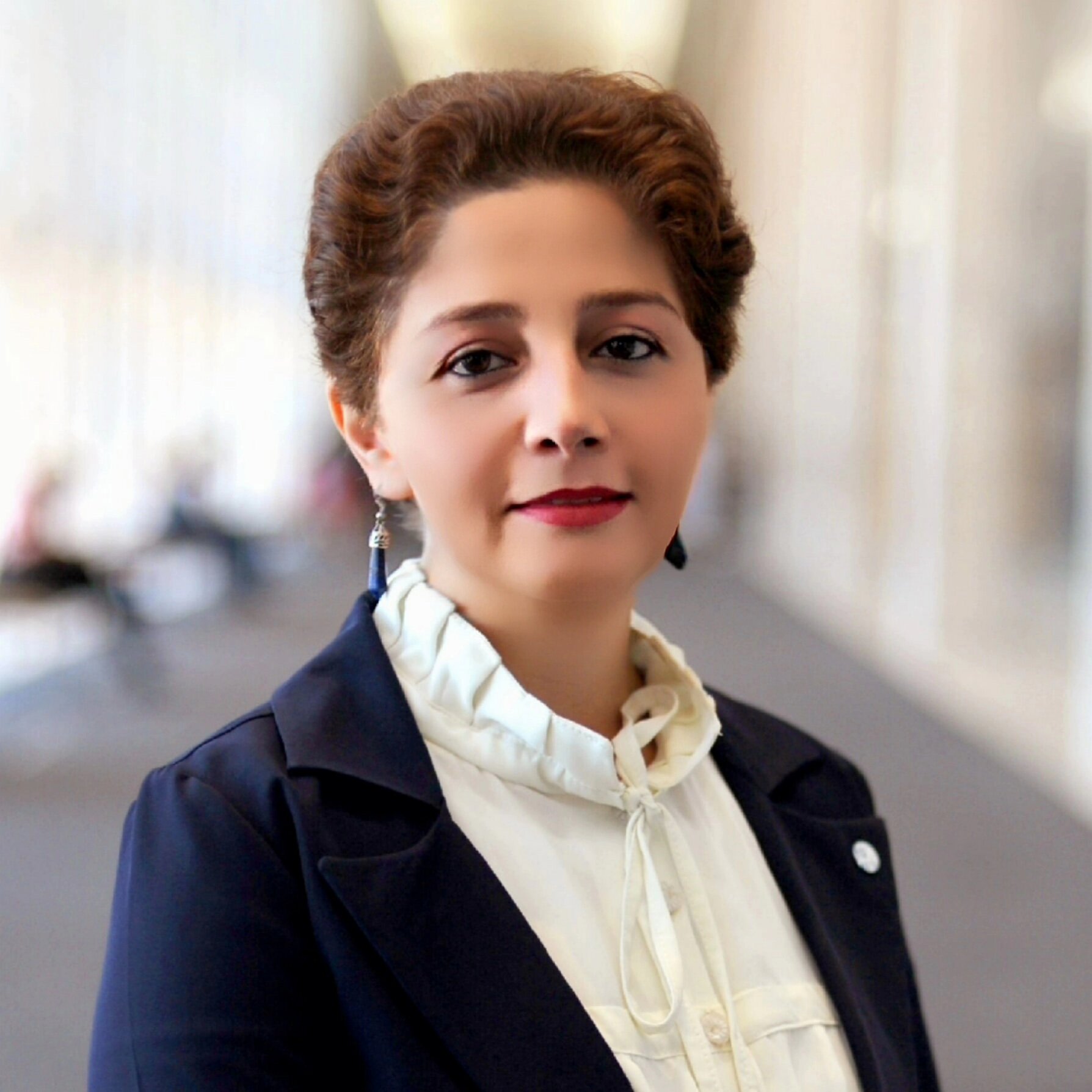 A headshot of Encieh Erfani.