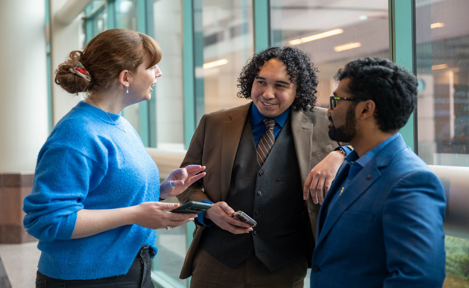 three people talking