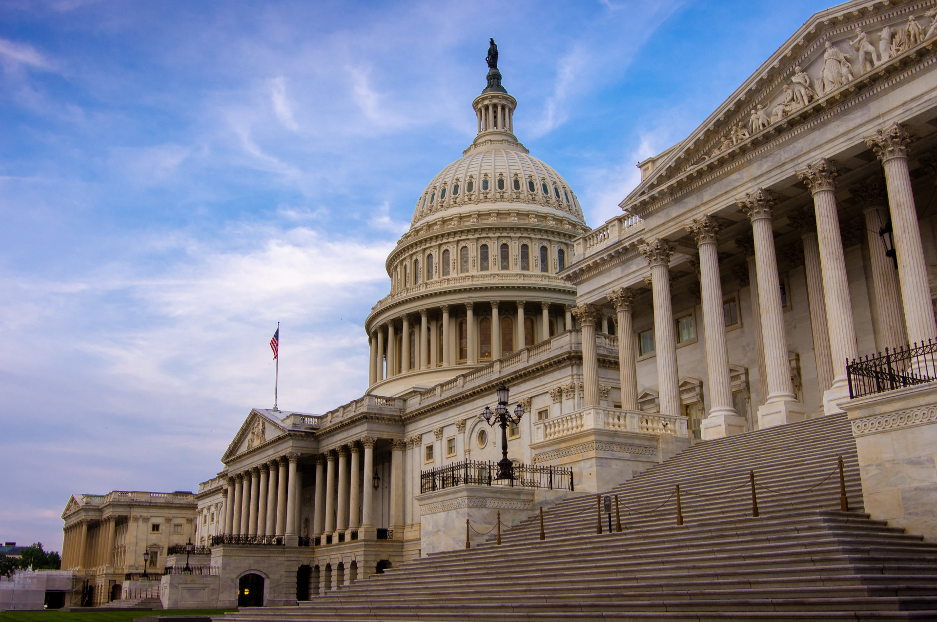 The Capitol Building in Washington, D.C., under a blue sky.