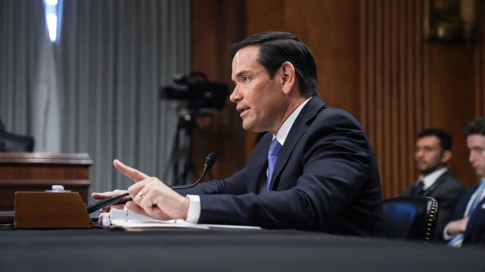 Marco Rubio speaks into the microphone during testimony before the Senate Foreign Relations Committee.