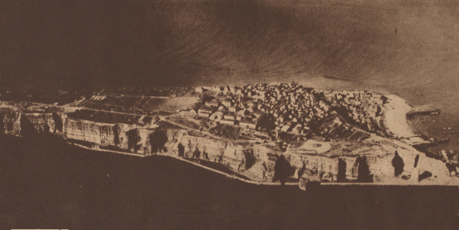 An aerial photograph of Helgoland shows a small, elongated island.