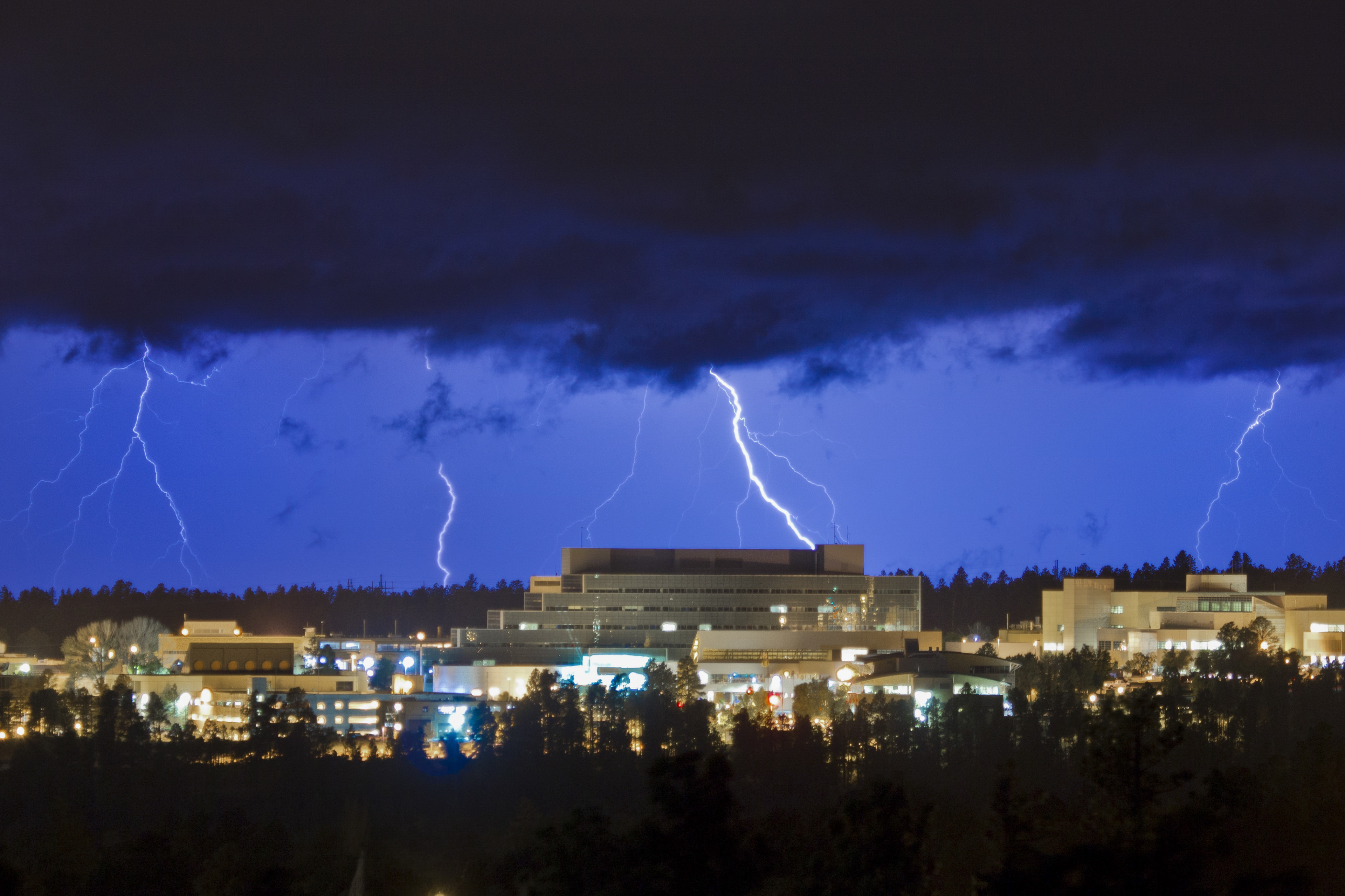 Los Alamos lab buildings under a stormy sky